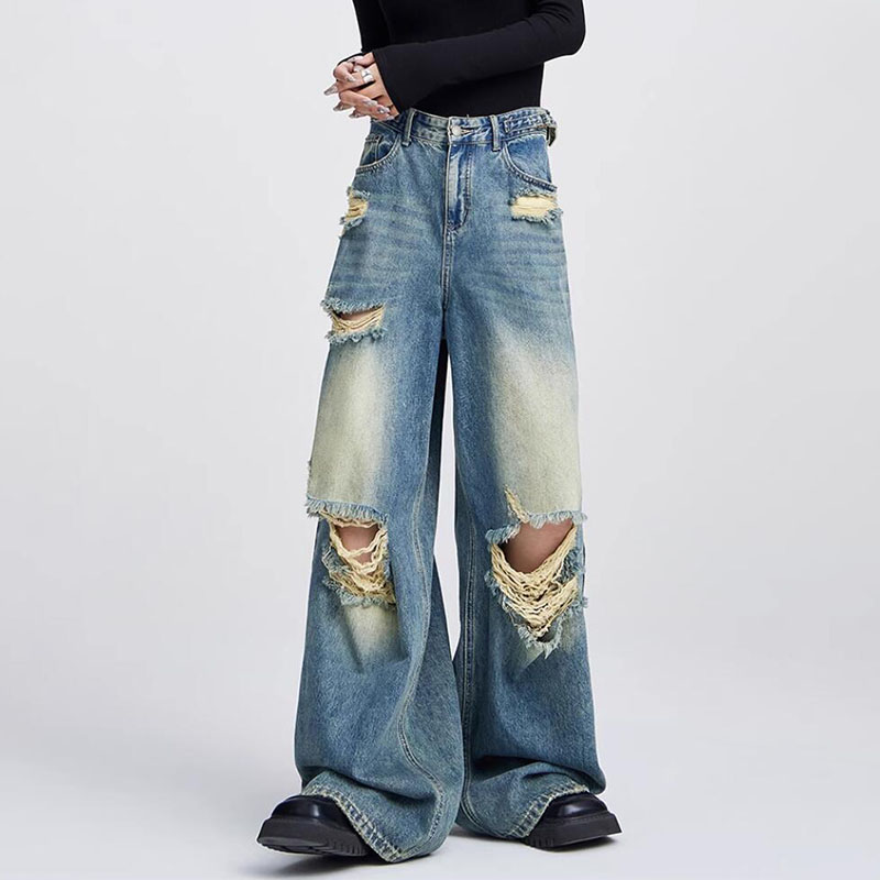 Wide leg ripped jeans styled with a fitted black top