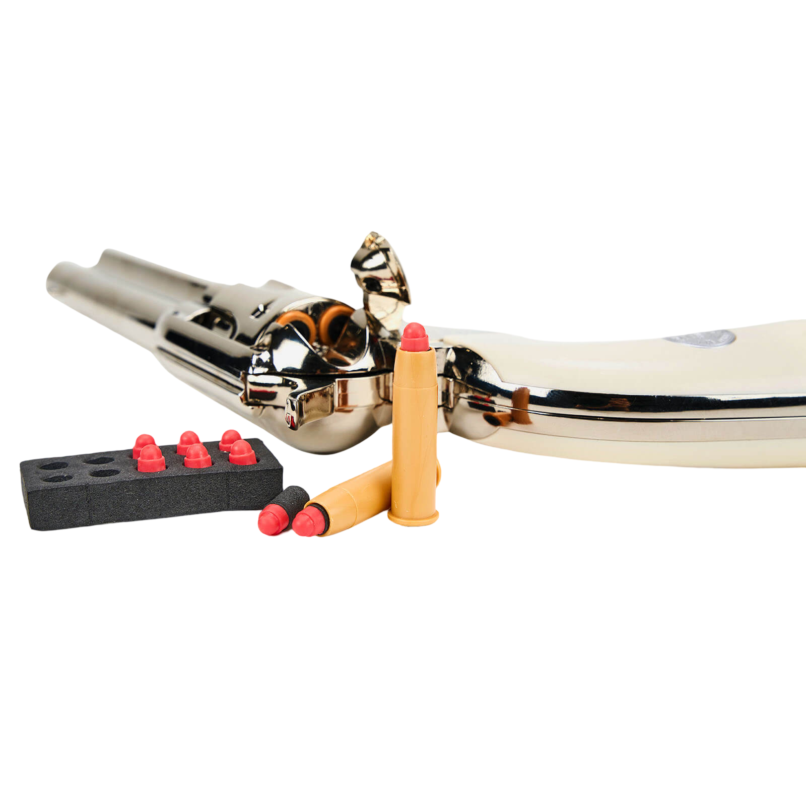 Nickel-plated toy revolver laid on its side with foam dart cartridges and loading block in the foreground.