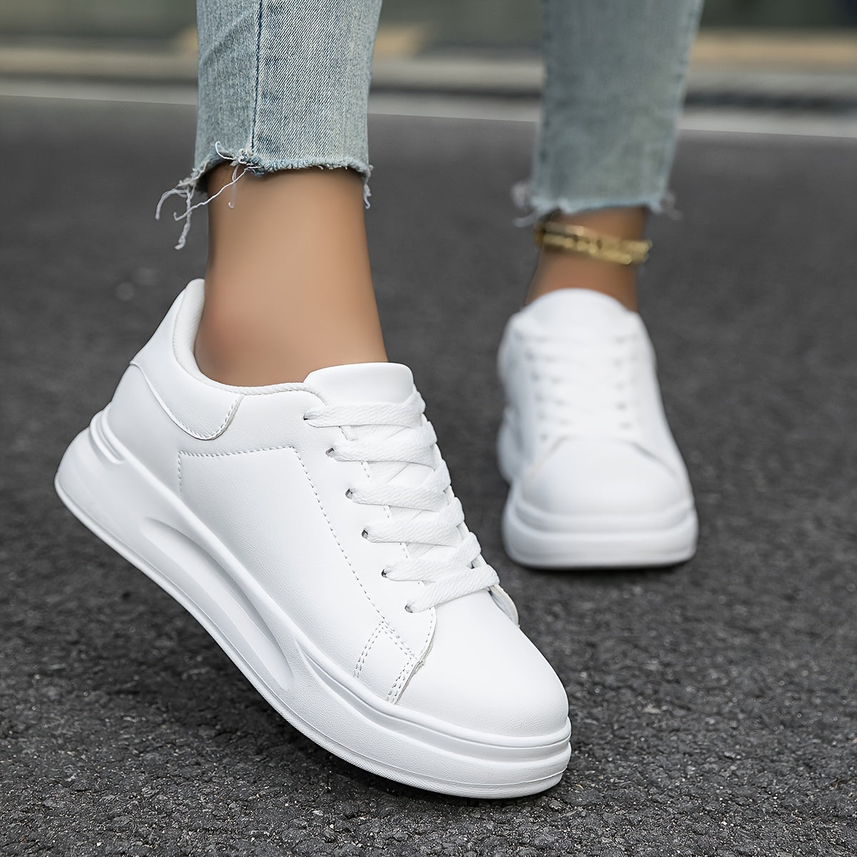 Woman wearing white leather sneakers