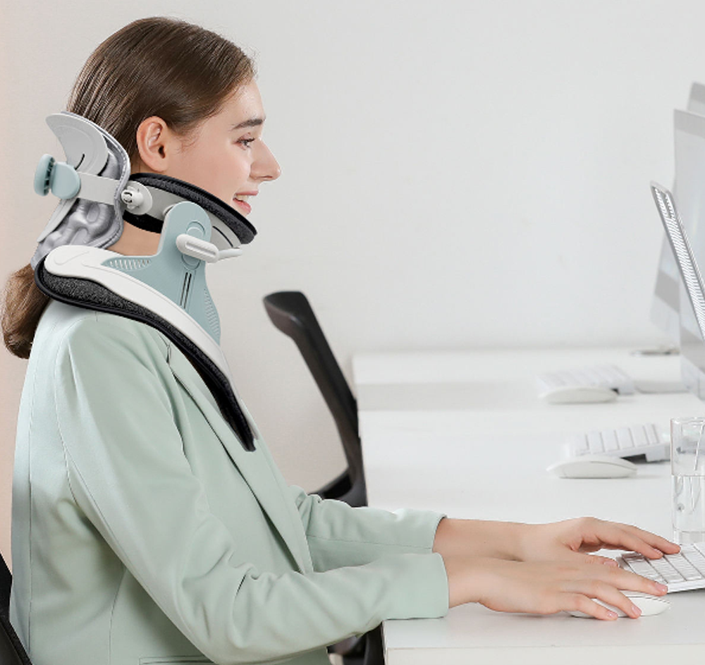 A modern cervical traction device designed to provide neck pain relief. The Cervitrax Gen-2 features an ergonomic design with adjustable straps, comfortable padding, and an easy-to-use inflation pump. The device is shown in use, supporting the user's neck and gently stretching the cervical spine for therapeutic benefits.