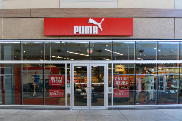 PUMA storefront in Outlet Collection at Niagara, Canada. Niagara On the Lake, Canada- June 27, 2022:  PUMA storefront in Outlet Collection at Niagara, a German company designs and manufactures athletic and casual footwear, apparel and accessories. the puma store stock pictures, royalty-free photos & images