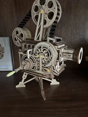 How do I build a simple hand-cranked film projector?