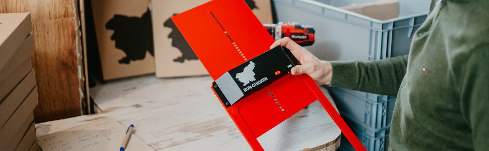 A man pushing the test button, setting the door with timer for precise opening time, light sensor.